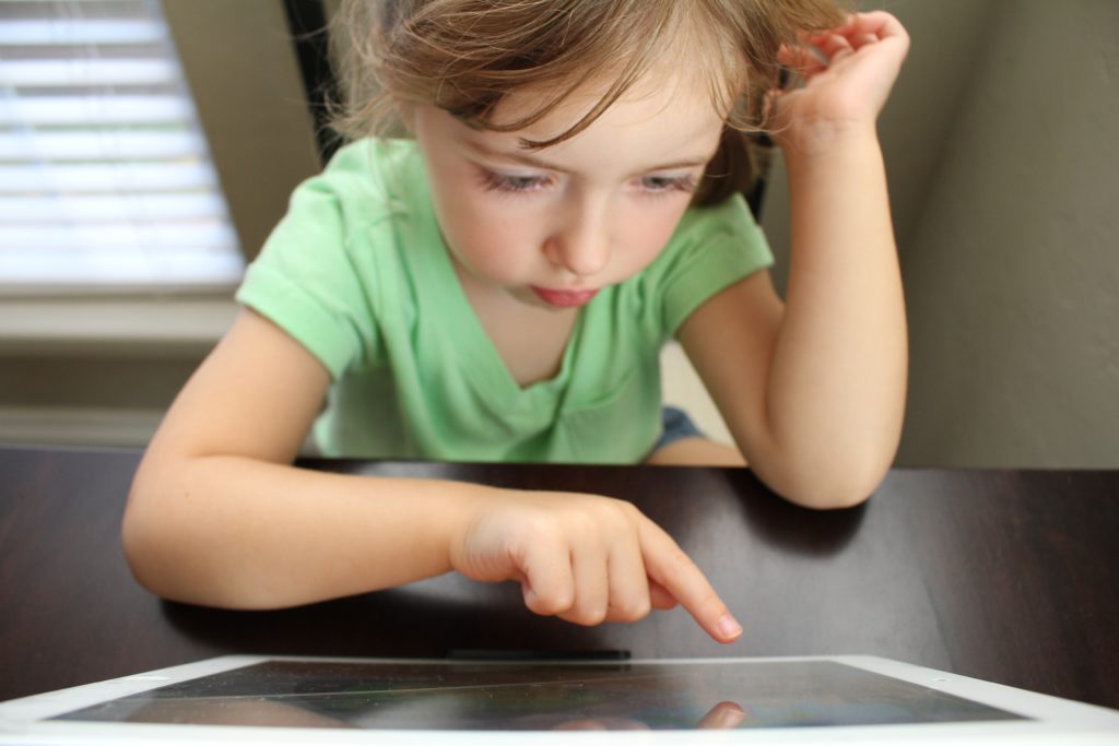 Child bored using screen