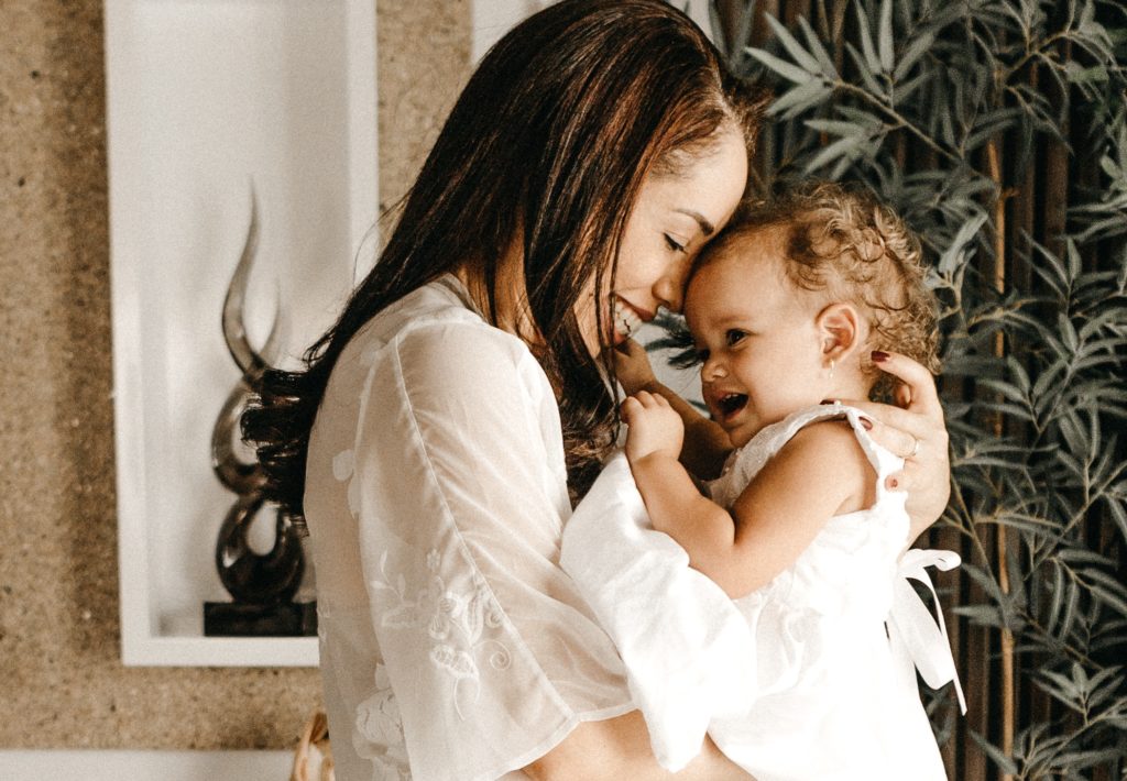 mother hugging baby