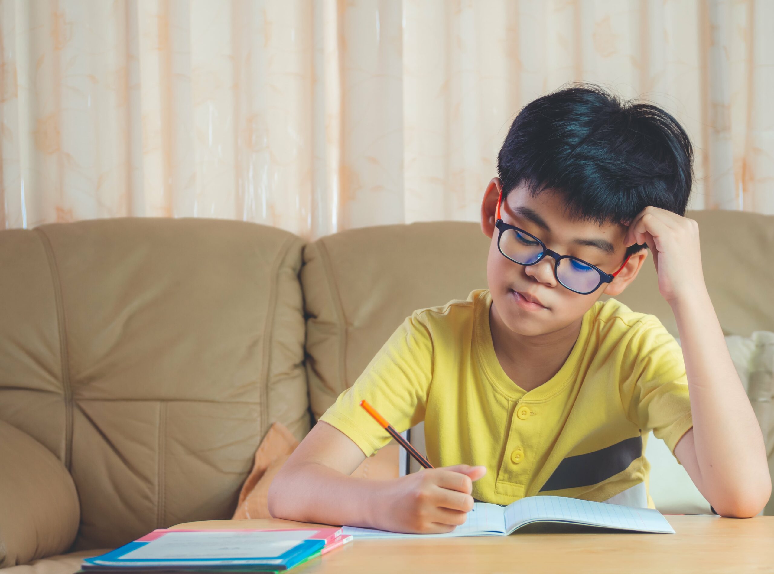 children with glasses studying